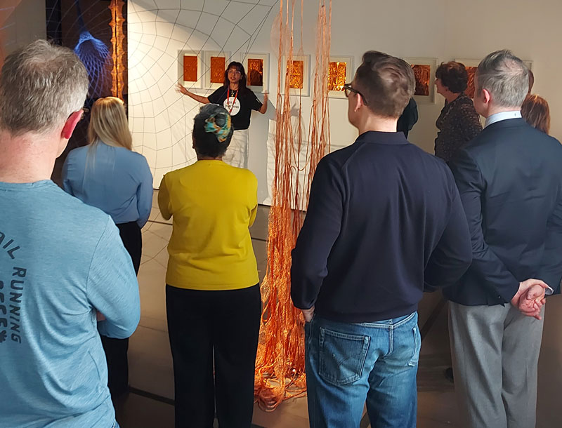 People looking at an art exhibition